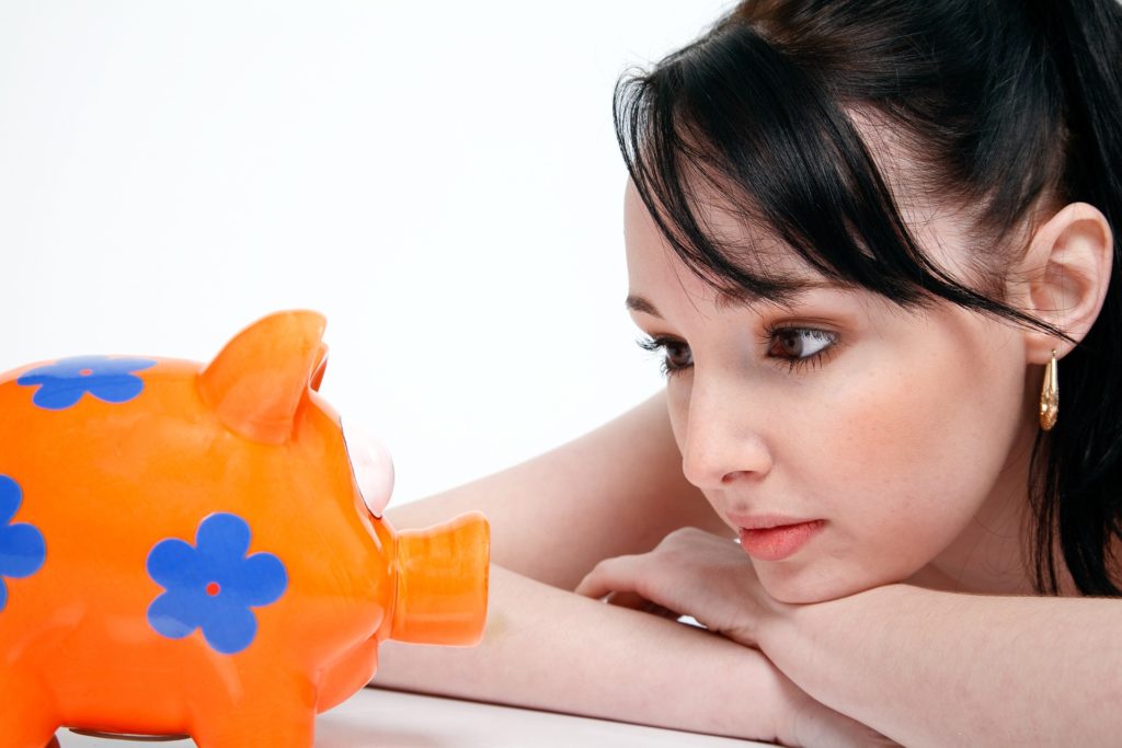 Girl with Piggy Bank